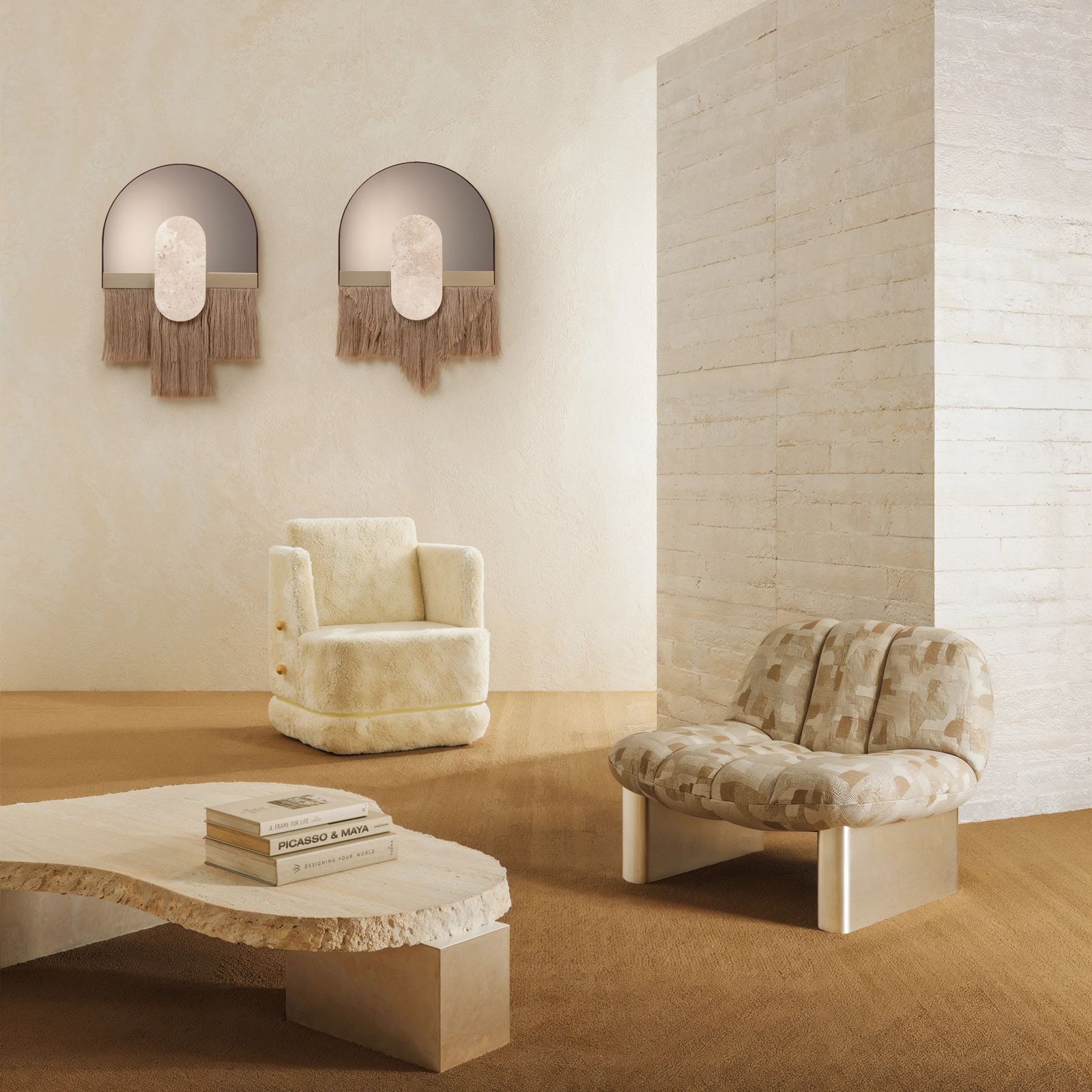Cream shearling armchair and travertine coffee table in a plaster-walled room