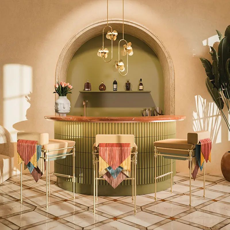Curved bar in olive green with brass stools and a fluted counter